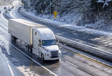 semi-truck driving in winter